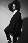 White dress shirt by Gucci, black pants and jacket by Hermes, hat by HM; Photography Leonardo Vecchiarelli